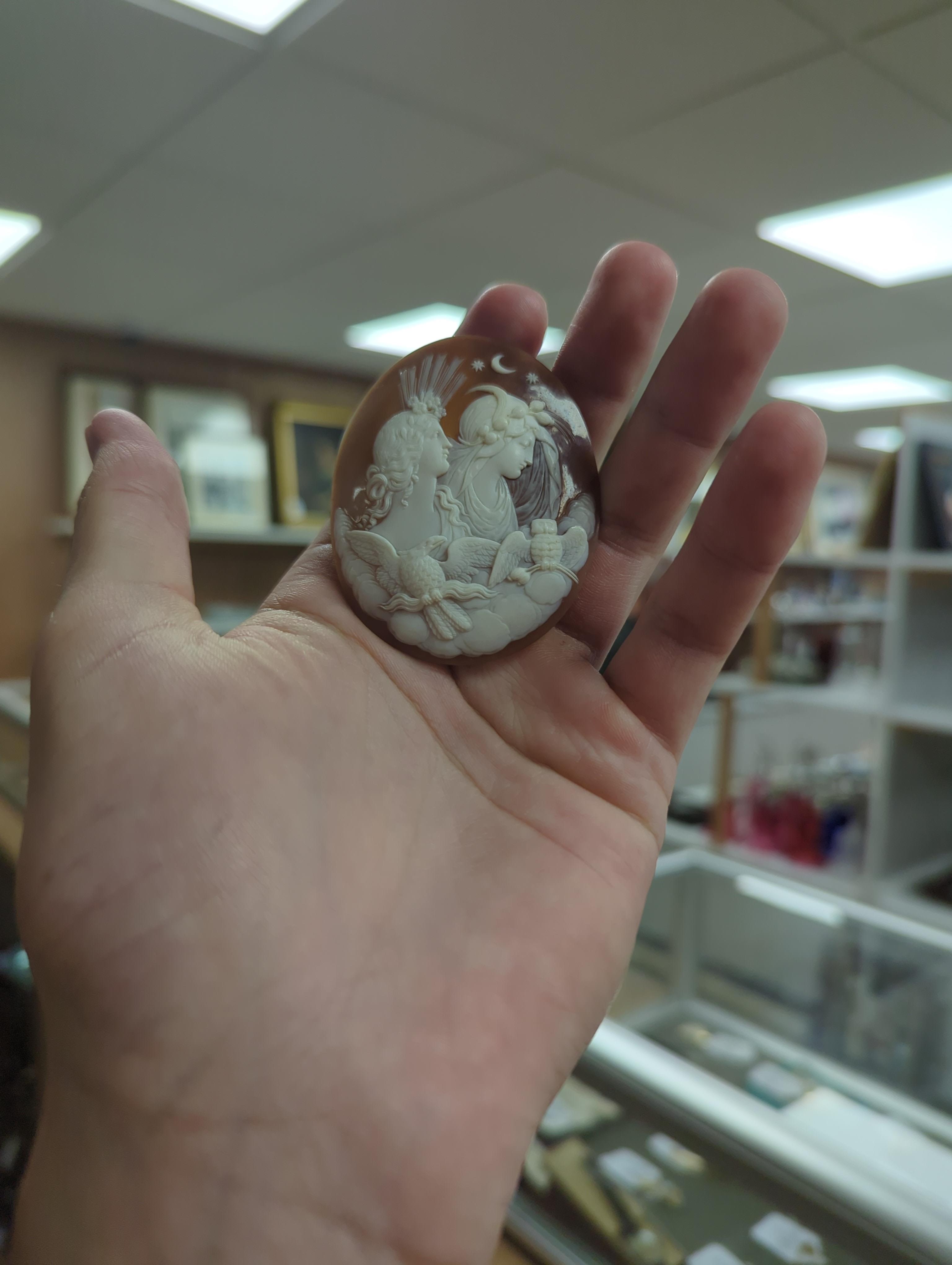 An unmounted Victorian cameo shell, carved with Selene and Diana, 61mm.